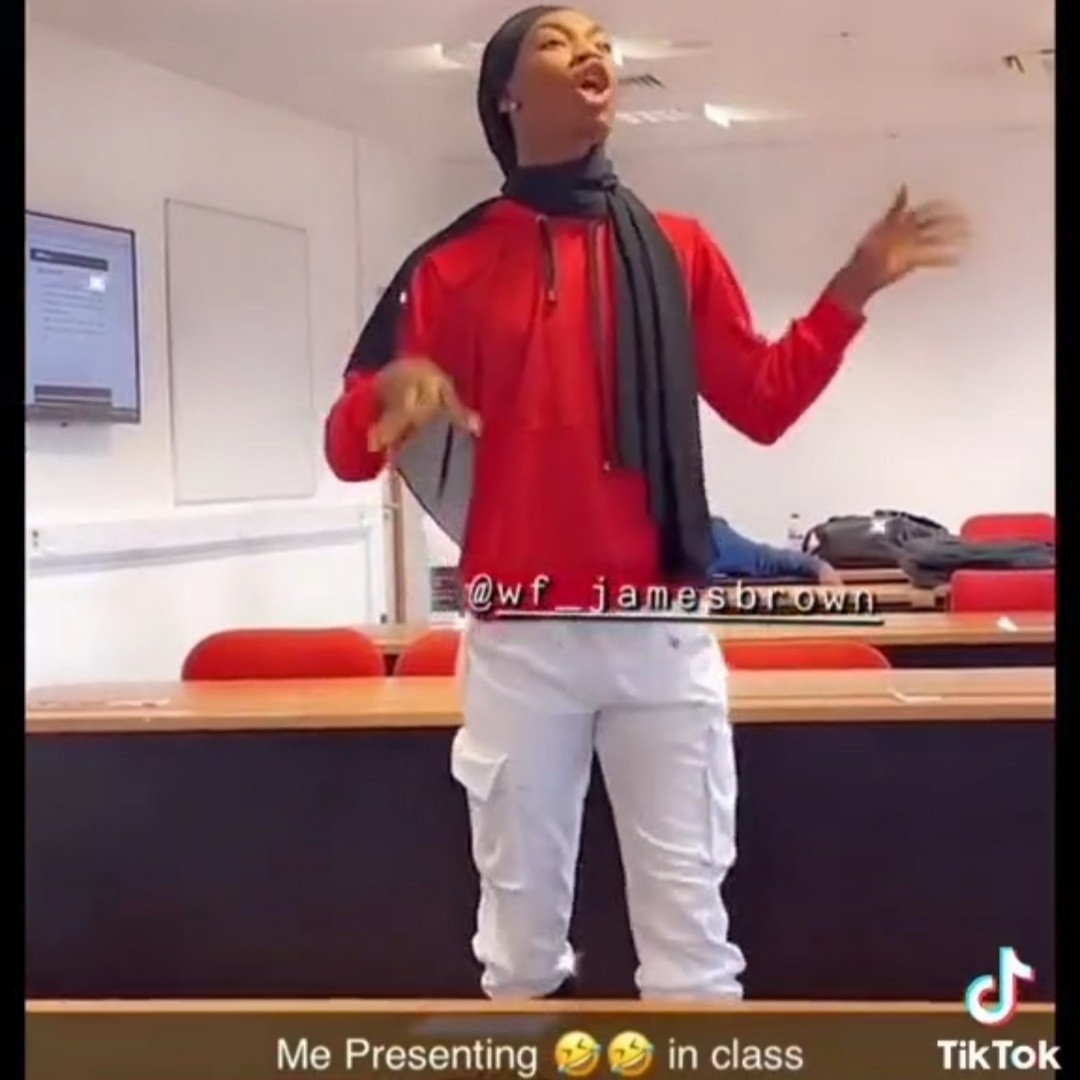 James Brown's coursemates laugh as the crossdresser gives a presentation in class (video)