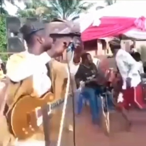 Musician and guests take to their heels at a funeral