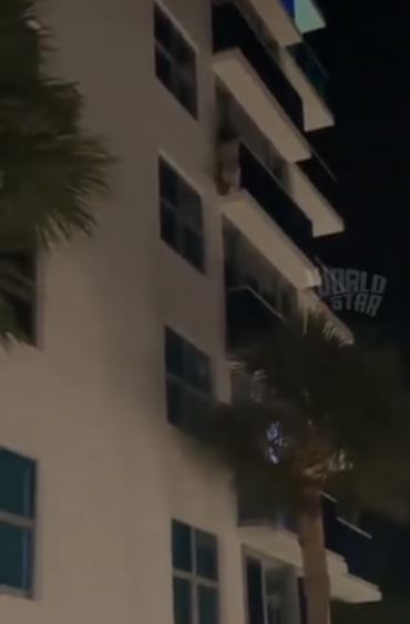 Side piece climbs down five floors from man's balcony after his main girl showed up unexpectedly (video)