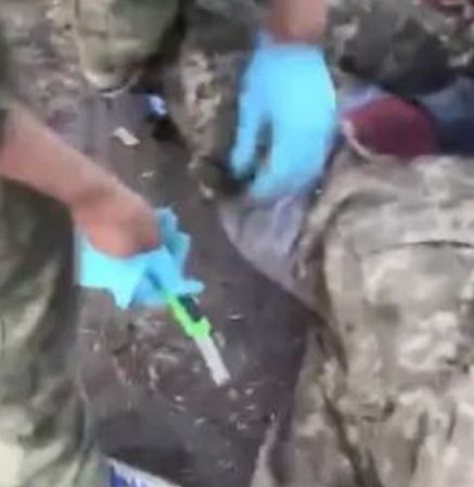 Sick video of Russian troops 'castrating' Ukrainian prisoner of war with boxcutter