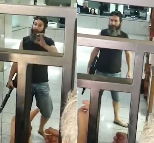 Man armed with a shotgun holds bank staff hostage and threatens to set himself on fire unless they hand over $200,000 locked in his account (videos)