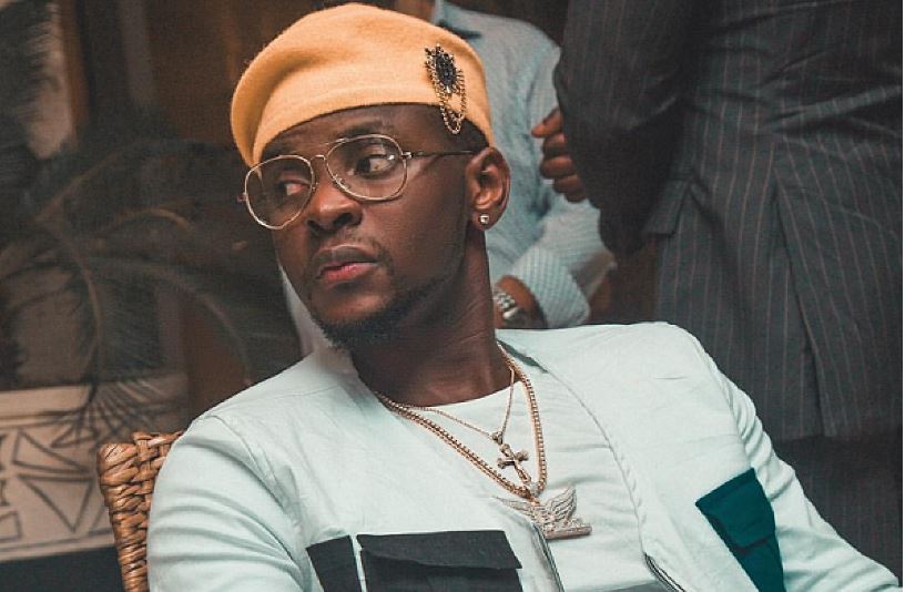 Kizz Daniel’s bodyguard throws fan off stage after he tried dancing with him [VIDEO]